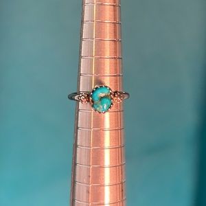 Turquoise gemstone ring with flowers.